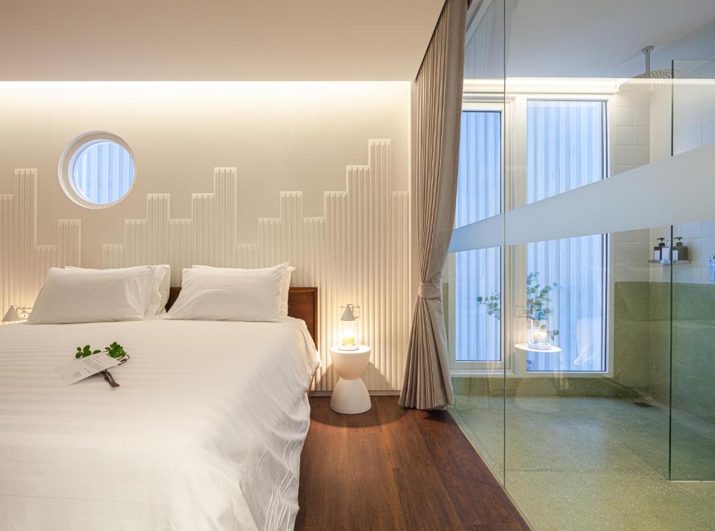 Postel nebo postele na pokoji v ubytování Bonsai Hotel Bangkok