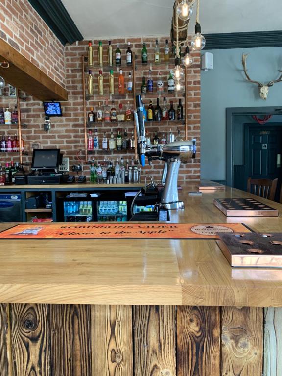 a bar with a microscope on top of a counter at The Bridge Inn in Tenbury