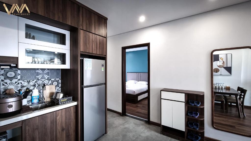 Kuchyň nebo kuchyňský kout v ubytování VNAHOMES APARTHOTEL