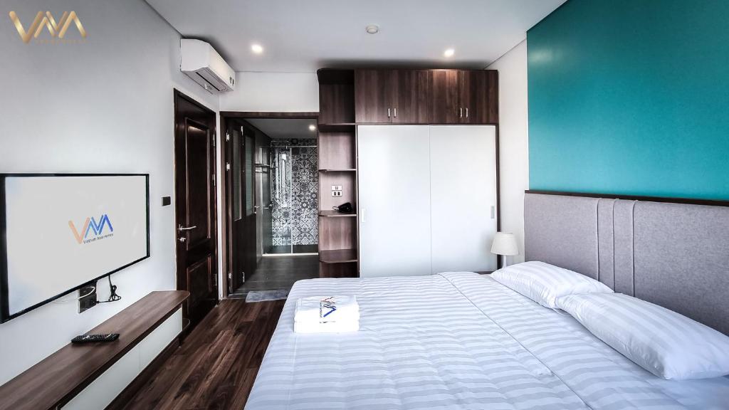 Postel nebo postele na pokoji v ubytování VNAHOMES APARTHOTEL