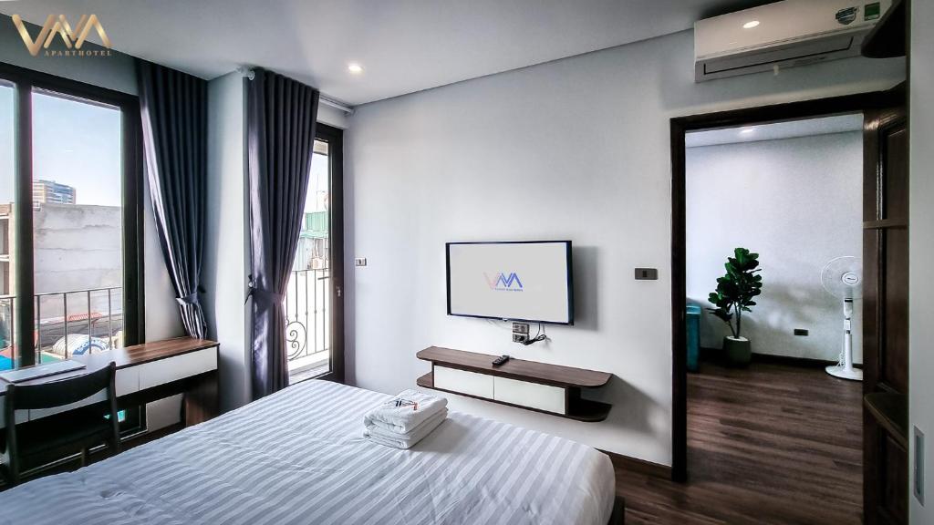 TV a/nebo společenská místnost v ubytování VNAHOMES APARTHOTEL