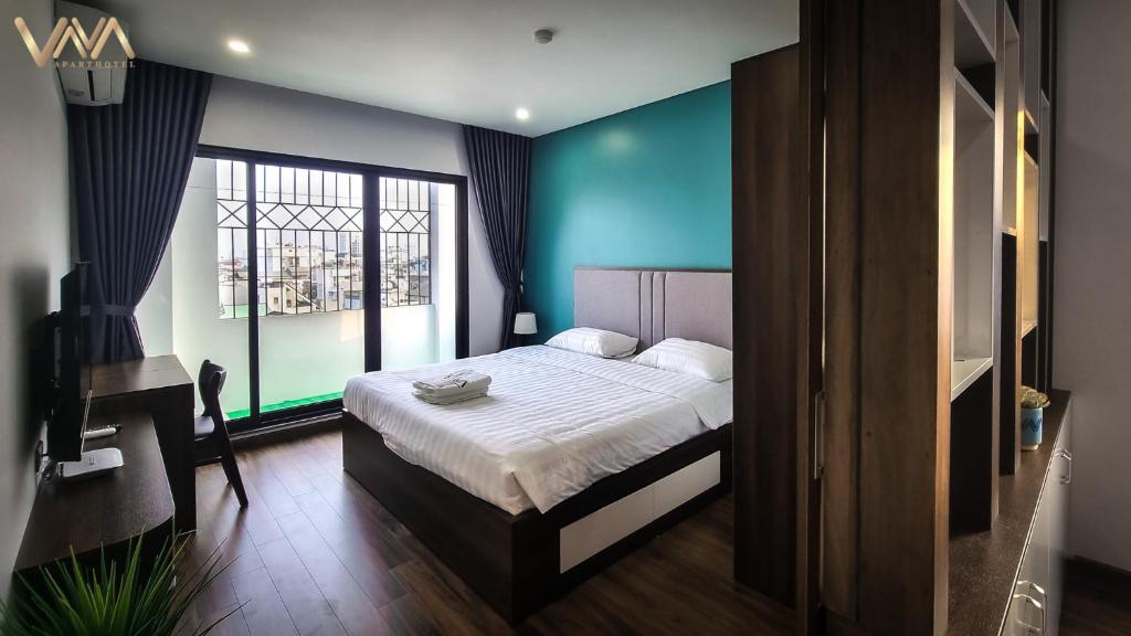 Postel nebo postele na pokoji v ubytování VNAHOMES APARTHOTEL
