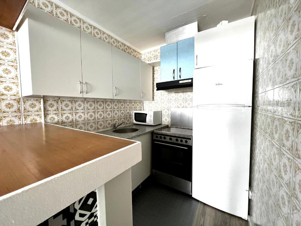 Kuchyň nebo kuchyňský kout v ubytování Apartamento royal marine en empuriabrava