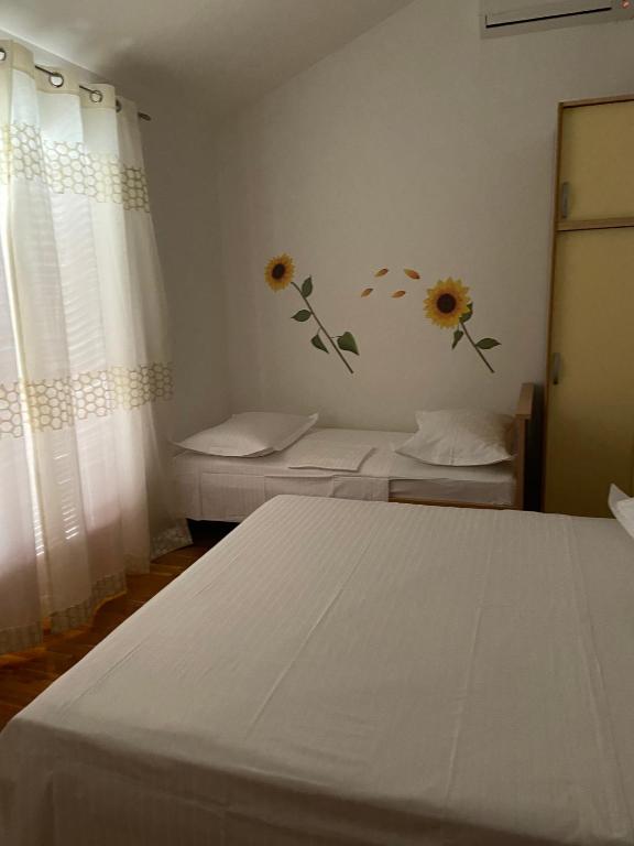 Postel nebo postele na pokoji v ubytování Apartmani Silence