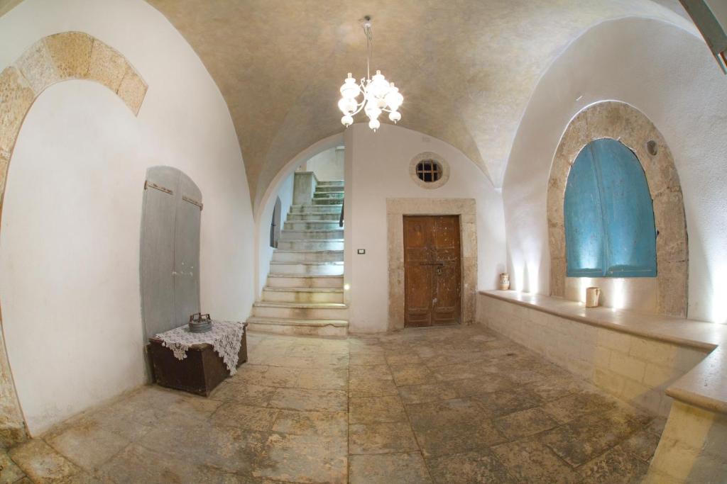 a hallway with arches and a staircase in a building at B&B Monsignore in Vieste