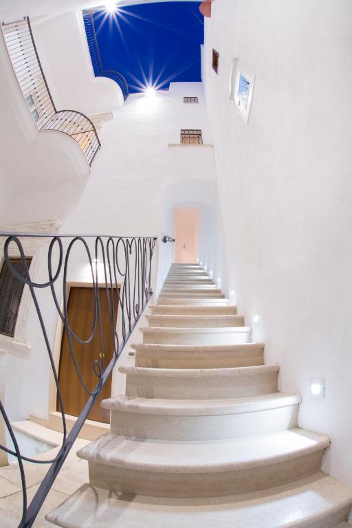 a staircase in a building with white walls and white floors at B&B Monsignore in Vieste