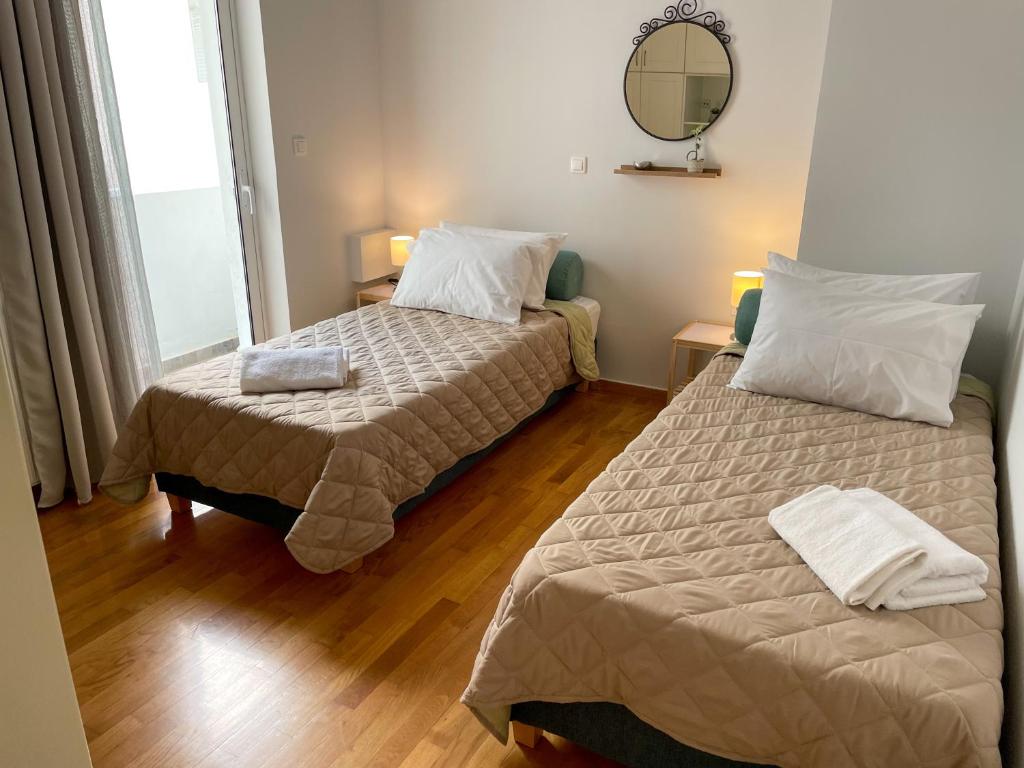Posteľ alebo postele v izbe v ubytovaní Ageliki's Athens Apartment