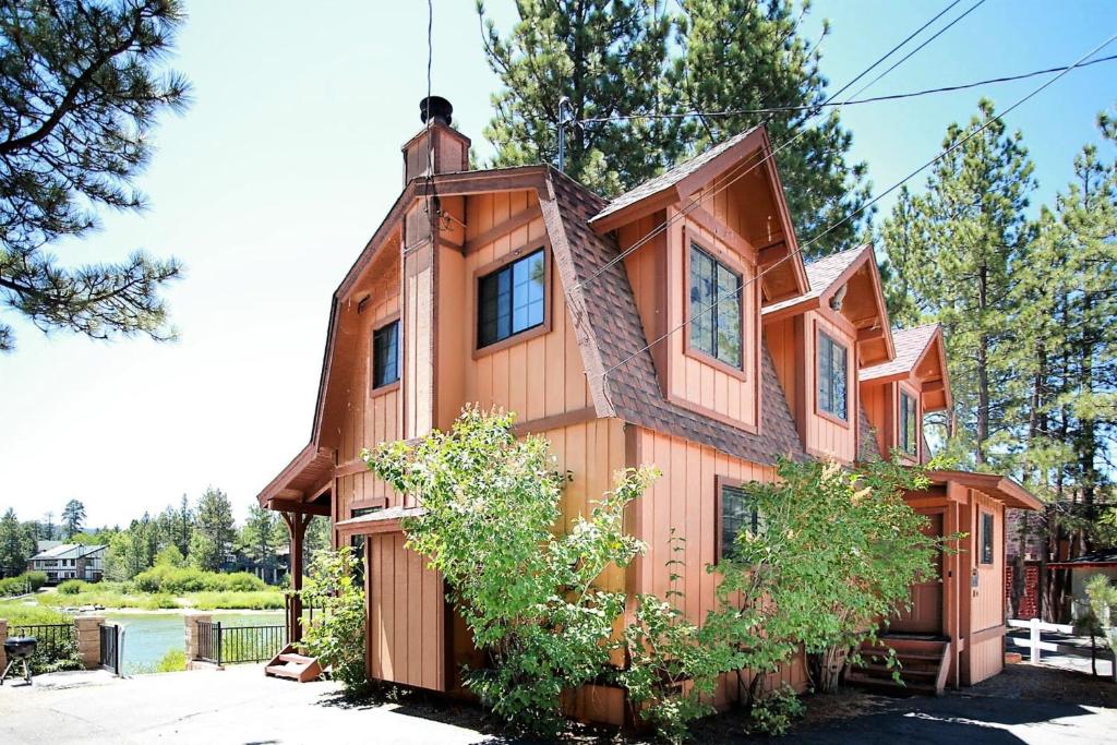 a wooden house with a gambrel roof at Breezy Two-113 by Big Bear Vacations in Big Bear Lake