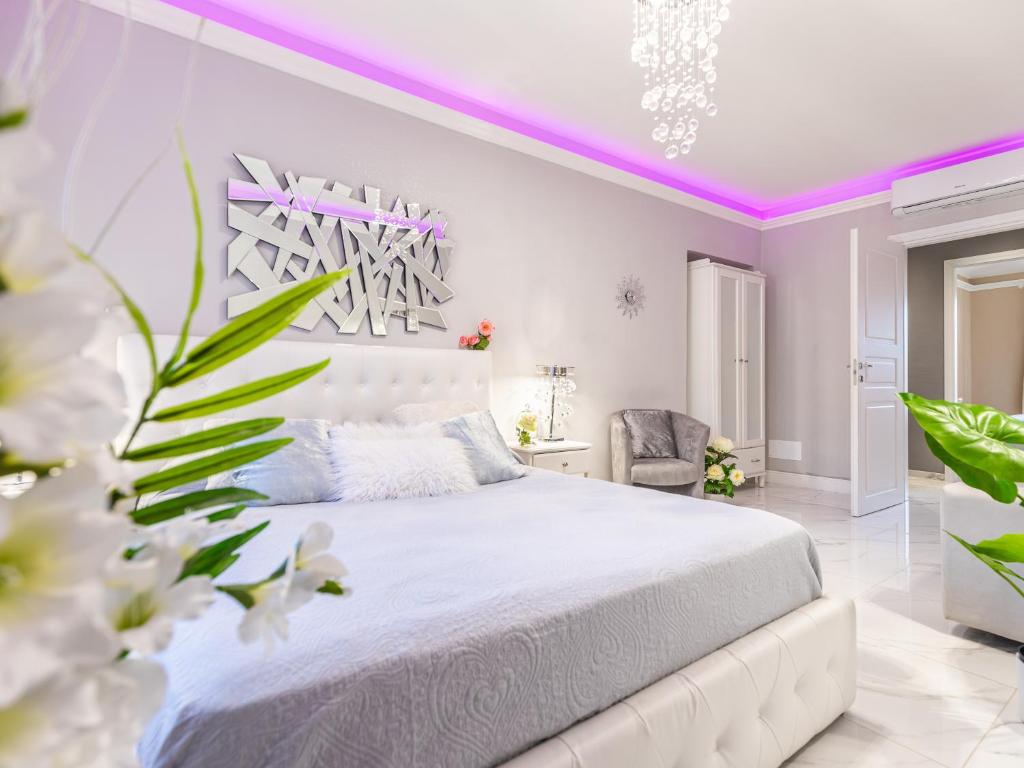 Posteľ alebo postele v izbe v ubytovaní ELEGANT SUITE - in centro PortaNuova