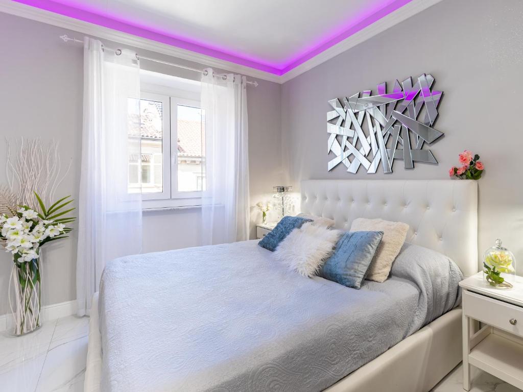 Posteľ alebo postele v izbe v ubytovaní ELEGANT SUITE - in centro PortaNuova