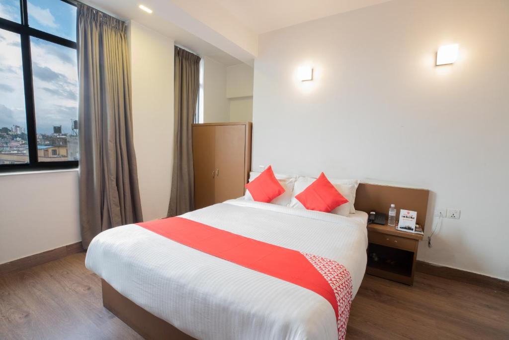 Postel nebo postele na pokoji v ubytování OYO 123 Hotel Prince Plaza