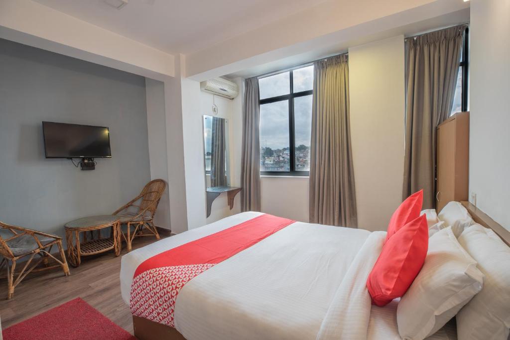 Postel nebo postele na pokoji v ubytování OYO 123 Hotel Prince Plaza