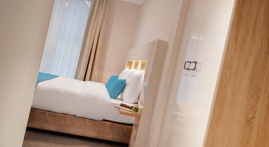 Postel nebo postele na pokoji v ubytování Hotel und Pension Seereich