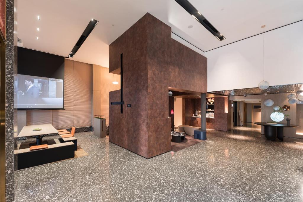TV a/nebo společenská místnost v ubytování Paco Hotel Canton Tower Pazhou