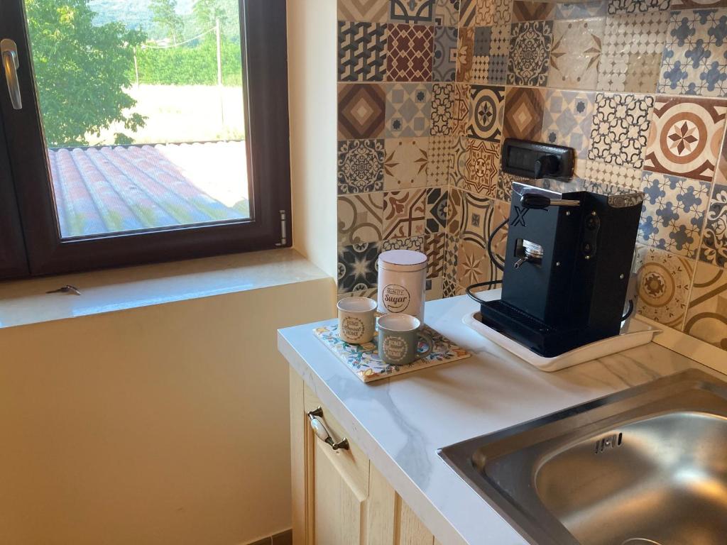 A kitchen or kitchenette at Masseria Le Zavattole