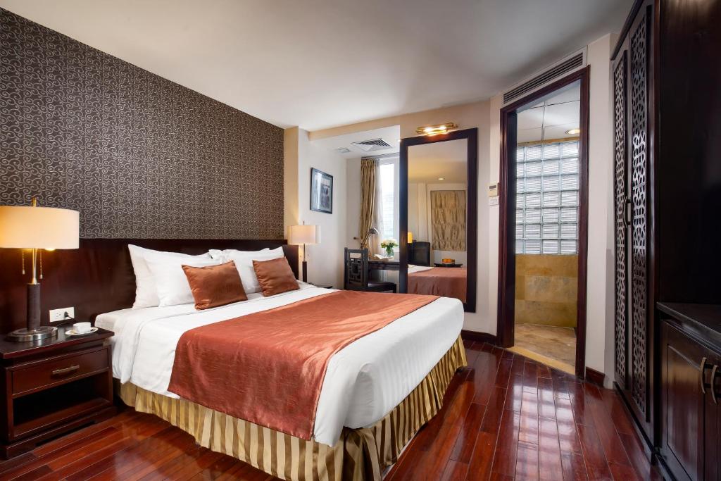 Postel nebo postele na pokoji v ubytování TK123 Hanoi Hotel