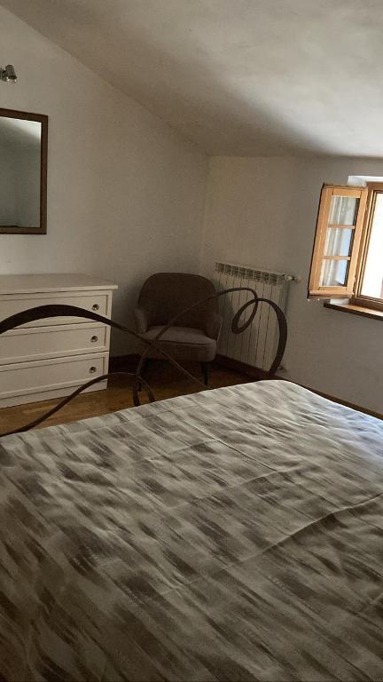 Postel nebo postele na pokoji v ubytování Lucignolo