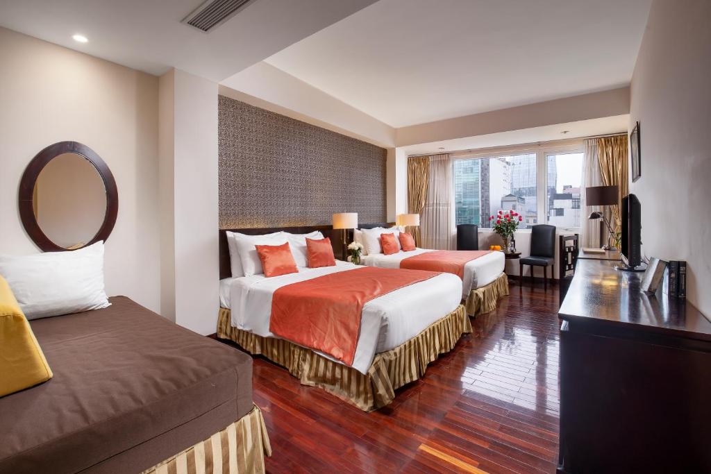 Postel nebo postele na pokoji v ubytování TK123 Hanoi Hotel