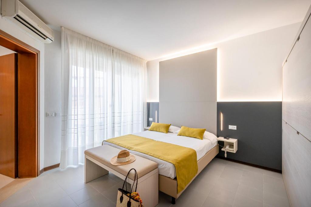 Postel nebo postele na pokoji v ubytování Hotel Marisa