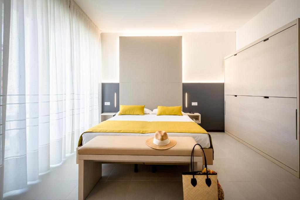 Postel nebo postele na pokoji v ubytování Hotel Marisa