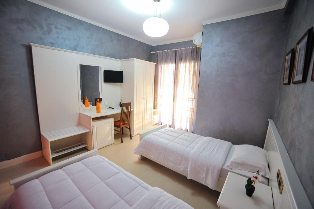 Postel nebo postele na pokoji v ubytování Iliria Internacional Hotel