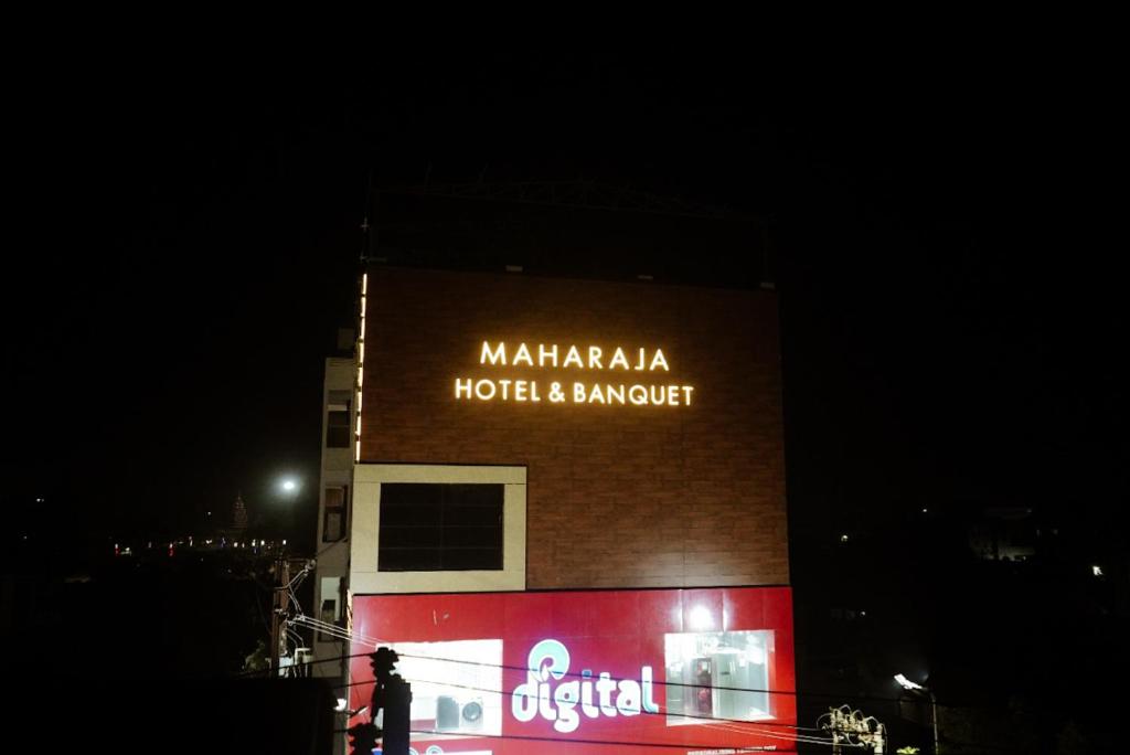 a building with a sign on the side of it at MAHARAJA HOTEL & BANQUET in Darbhanga
