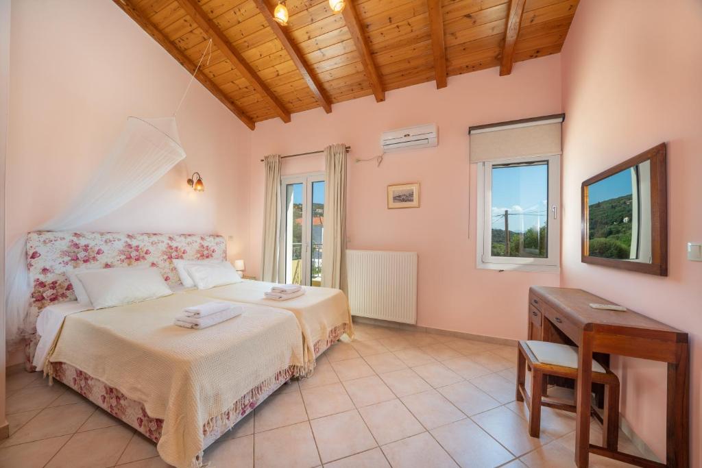 Postel nebo postele na pokoji v ubytování Villa Emily