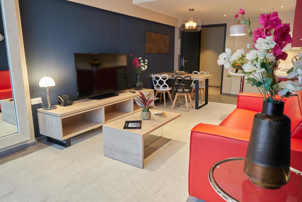 TV a/nebo společenská místnost v ubytování Gran Evenia Panamá Hotel