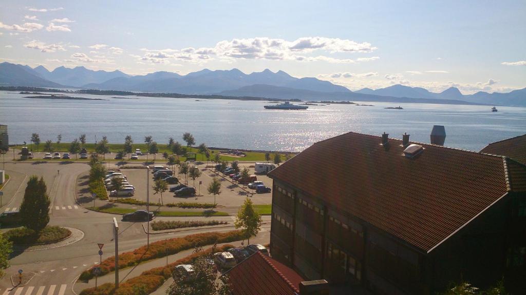 a view of a large body of water with mountains at Fjord Panorama Homestay in Molde