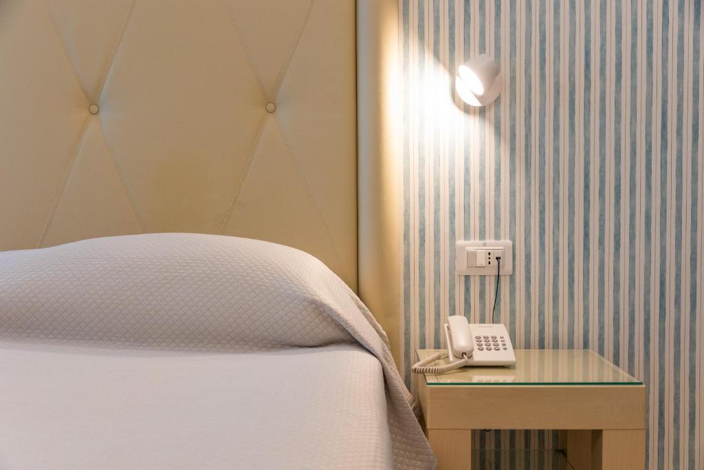 Posteľ alebo postele v izbe v ubytovaní Grand Hotel Park