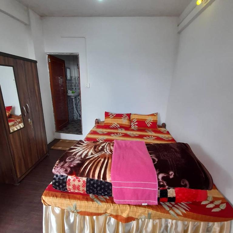 Postel nebo postele na pokoji v ubytování Jasmine Homestay Darjeeling