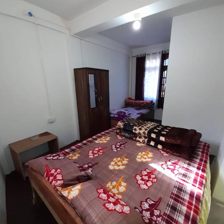 Postel nebo postele na pokoji v ubytování Jasmine Homestay Darjeeling