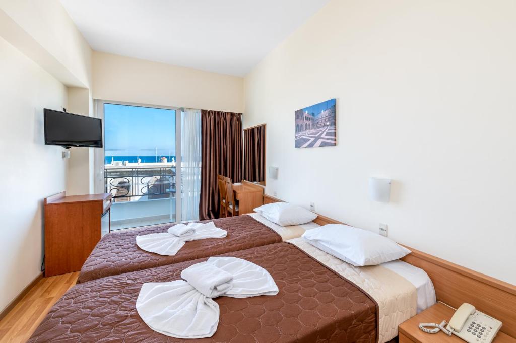 Postel nebo postele na pokoji v ubytování Hotel Hermes