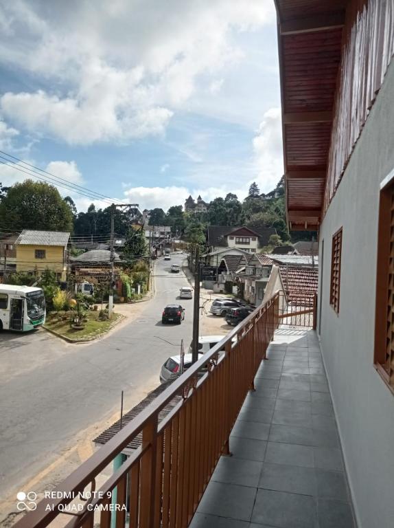 a balcony with a view of a street at Casa Recanto in Campos do Jordão