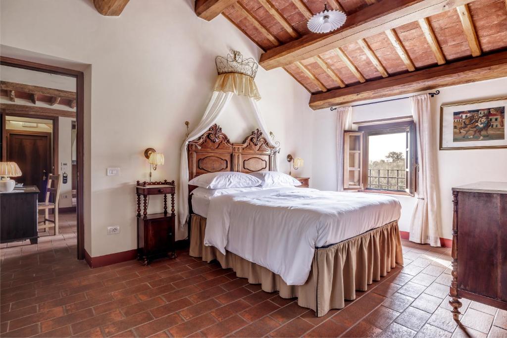 Un pat sau paturi într-o cameră la B&B Hotel La Piana