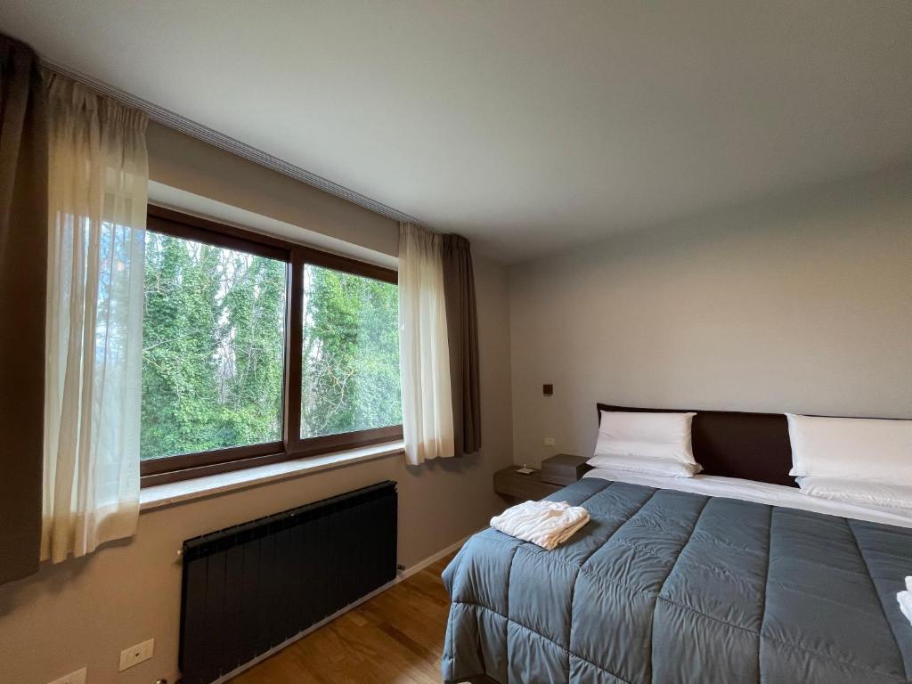 Postel nebo postele na pokoji v ubytování Aminta Resort
