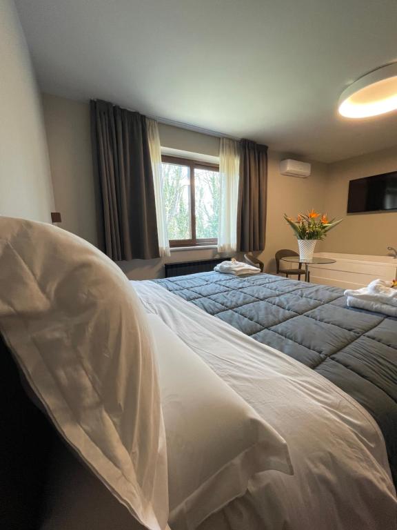 Postel nebo postele na pokoji v ubytování Aminta Resort