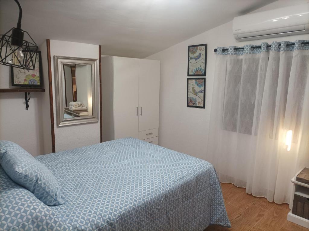Postel nebo postele na pokoji v ubytování Casa La Piedra