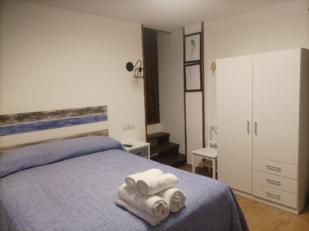Postel nebo postele na pokoji v ubytování Casa La Piedra
