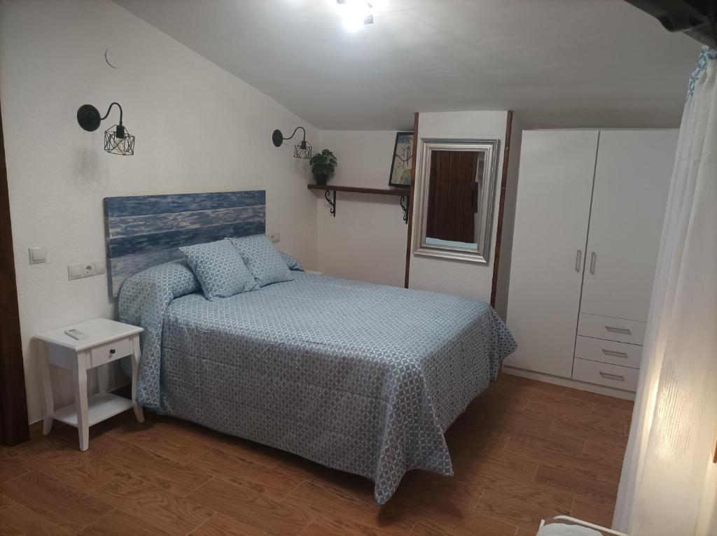 Postel nebo postele na pokoji v ubytování Casa La Piedra