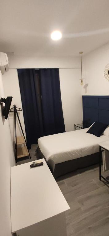 Postel nebo postele na pokoji v ubytování ROOMS Los MONTES