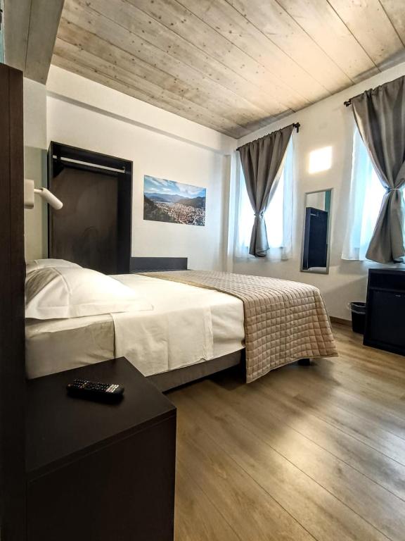 Postel nebo postele na pokoji v ubytování Il B&B di PIAZZA MOTTA