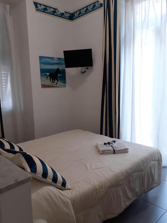 Postel nebo postele na pokoji v ubytování L'Angelo Blu