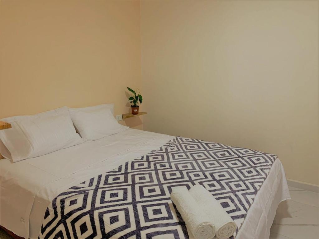Posteľ alebo postele v izbe v ubytovaní Buritaca House