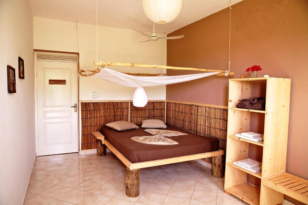 Postel nebo postele na pokoji v ubytování Casa Strela B&B Tarrafal