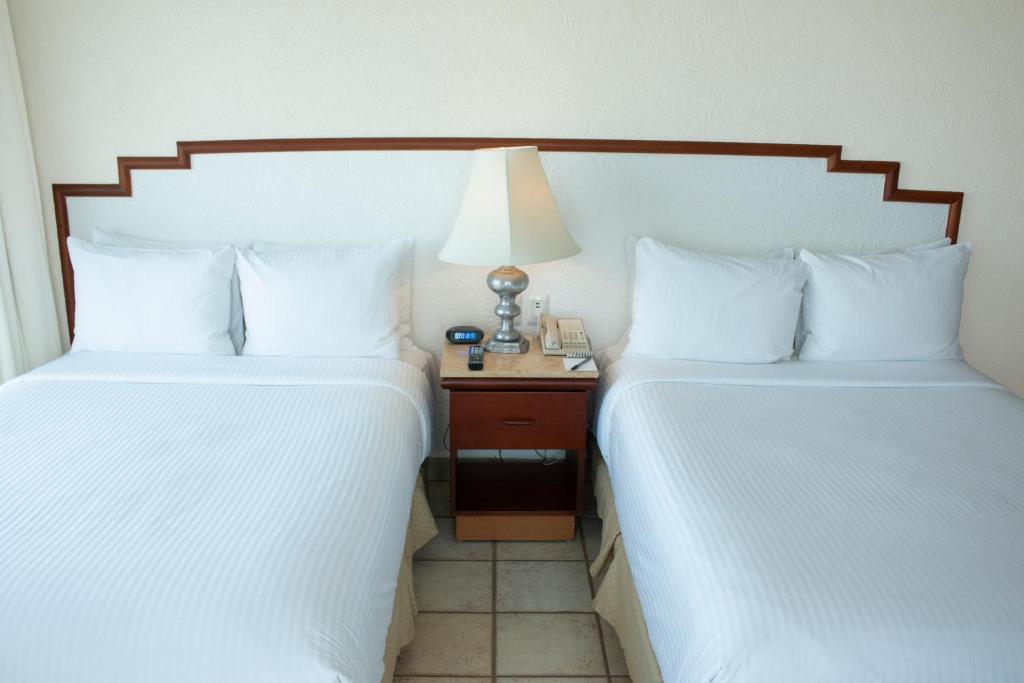 Emporio Ixtapa - with Optional All Inclusive客房内的一张或多张床位