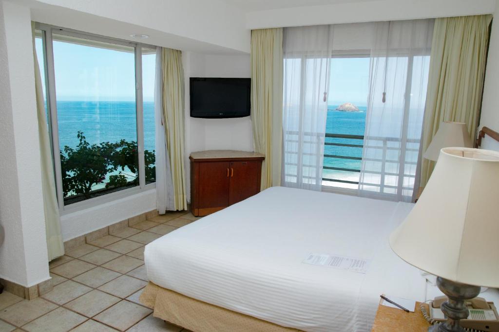 Emporio Ixtapa - with Optional All Inclusive客房内的一张或多张床位