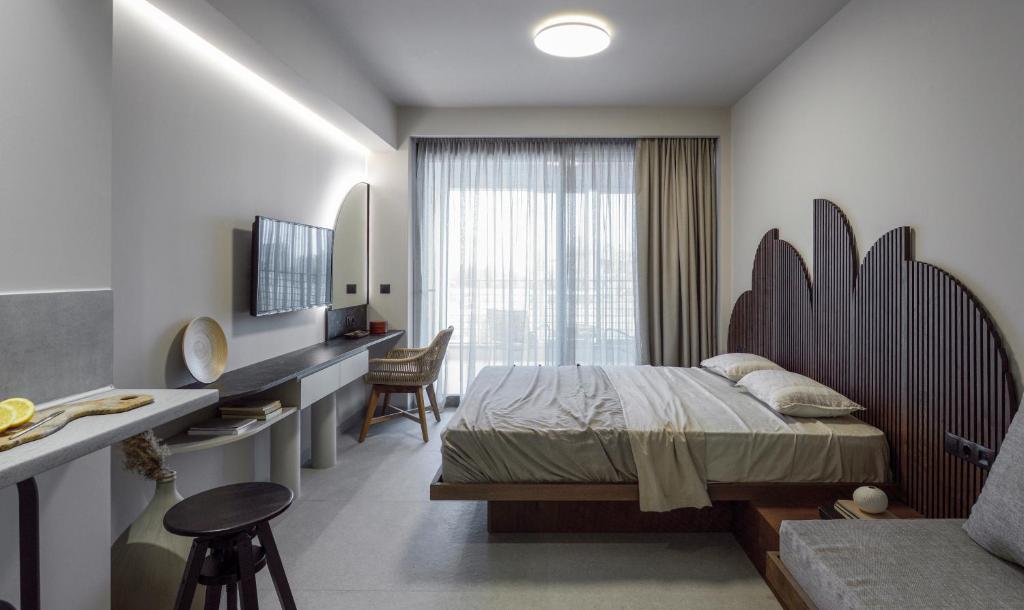 Posteľ alebo postele v izbe v ubytovaní ANASSA BUTIK LIVING NIKITI