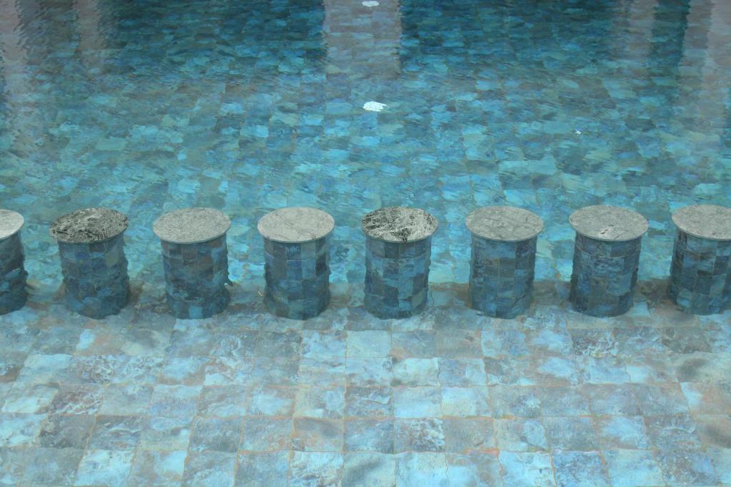 a row of pillars in a pool of water at Valley Boutique Hotel in Safi
