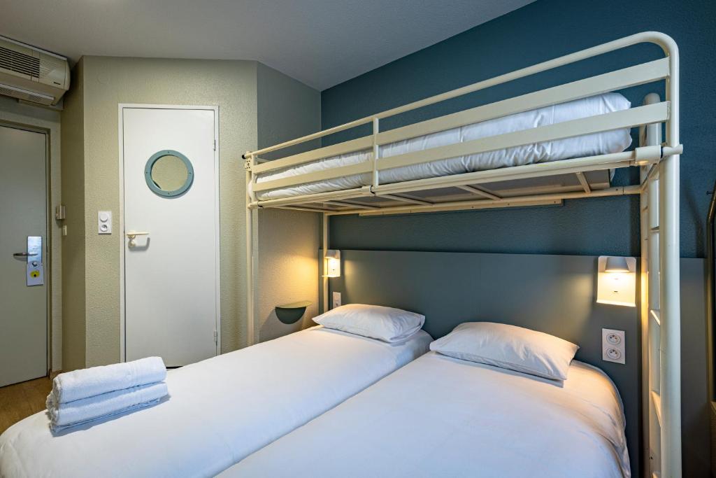 Postel nebo postele na pokoji v ubytování Vini Hotel